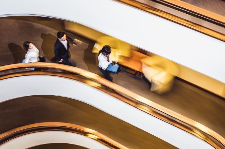 Business People Walking Down The Hallway